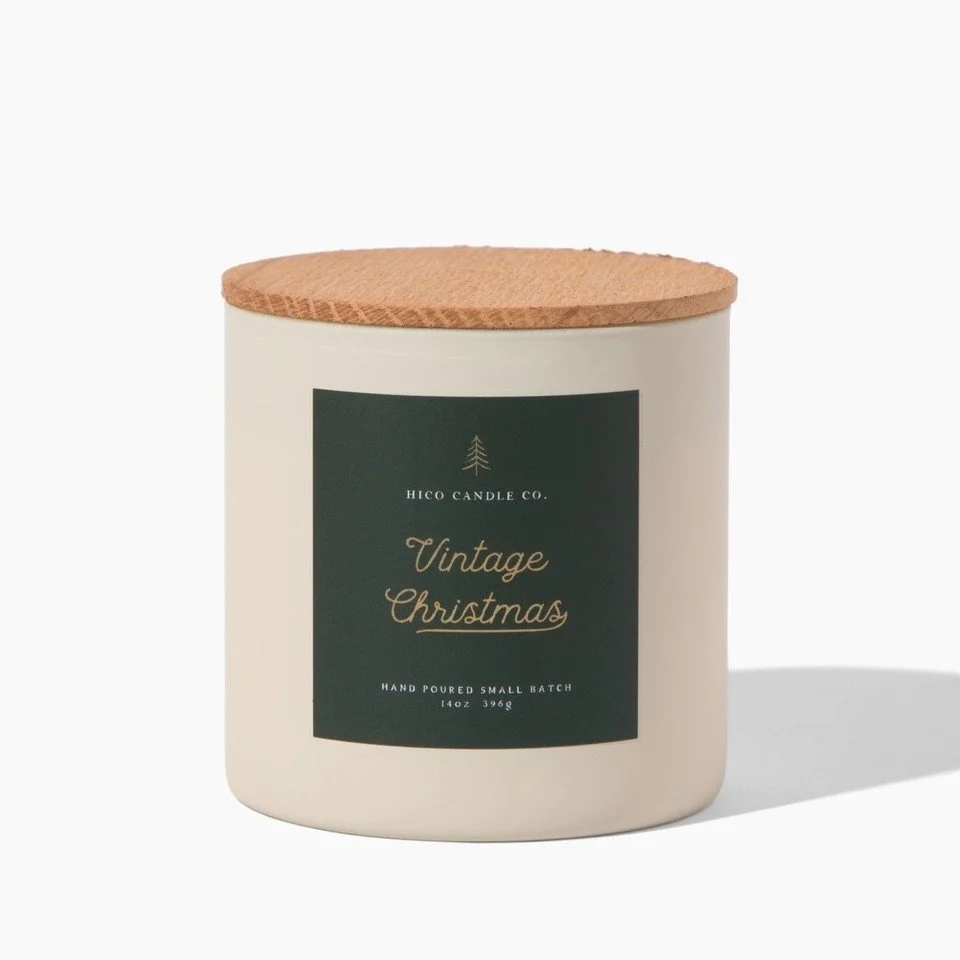 Christmas soy candle in a 14 oz jar featuring pine, cedarwood, orange peel, cinnamon, clove, and warm caramel fragrance notes.