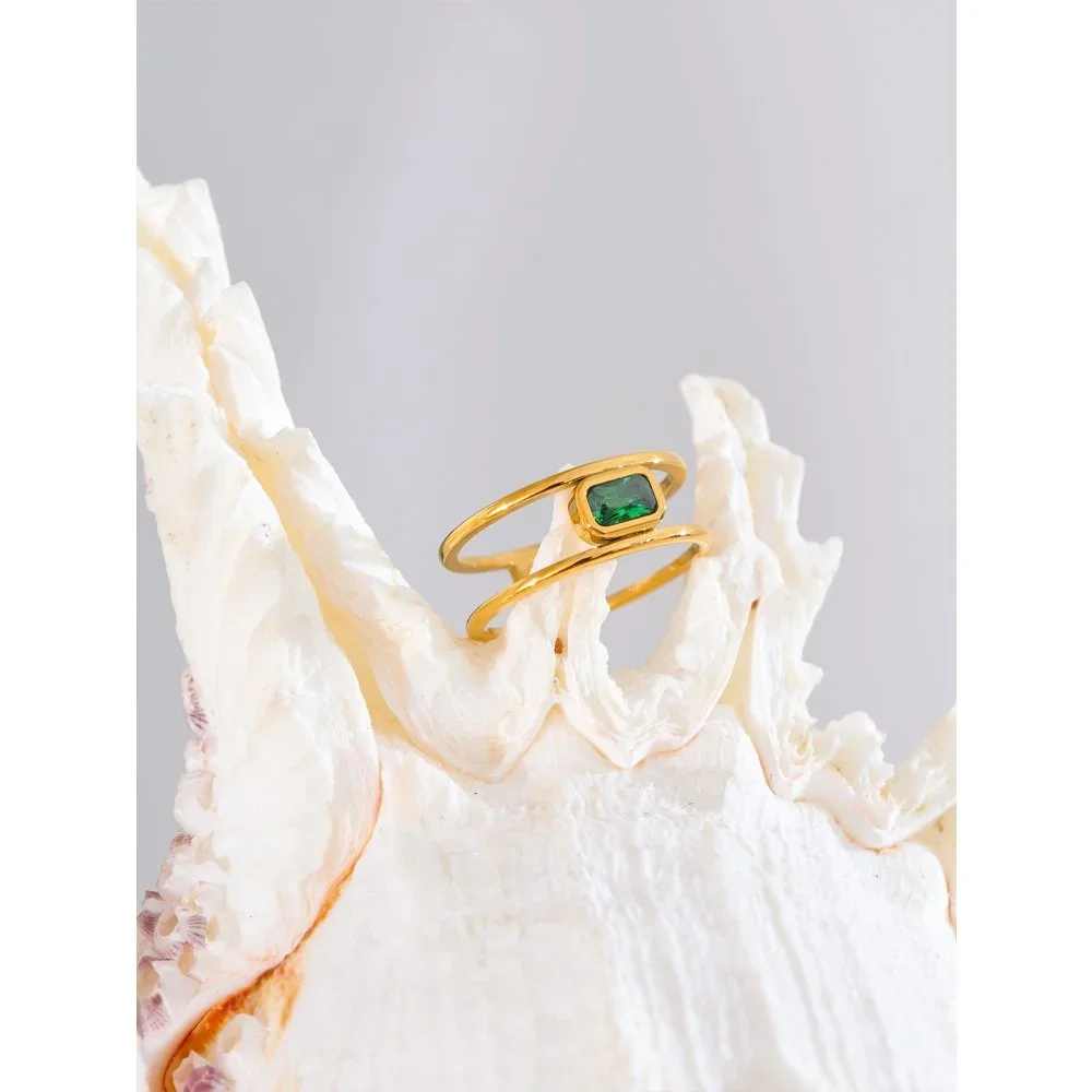 Parker Emerald Gemstone Gold Ring featuring a vibrant green emerald stone set in a polished gold band with an elegant timeless design.