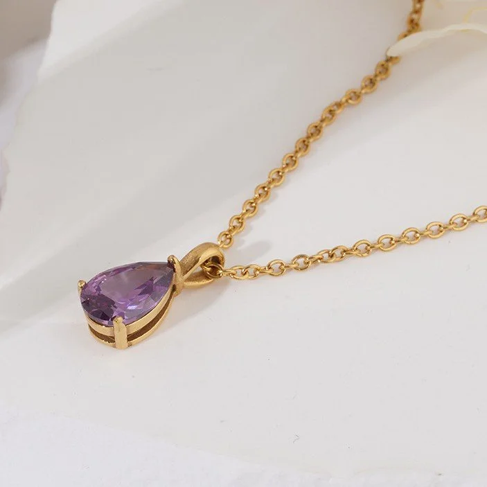 18k gold plated necklace with a teardrop shaped purple amethyst gemstone.