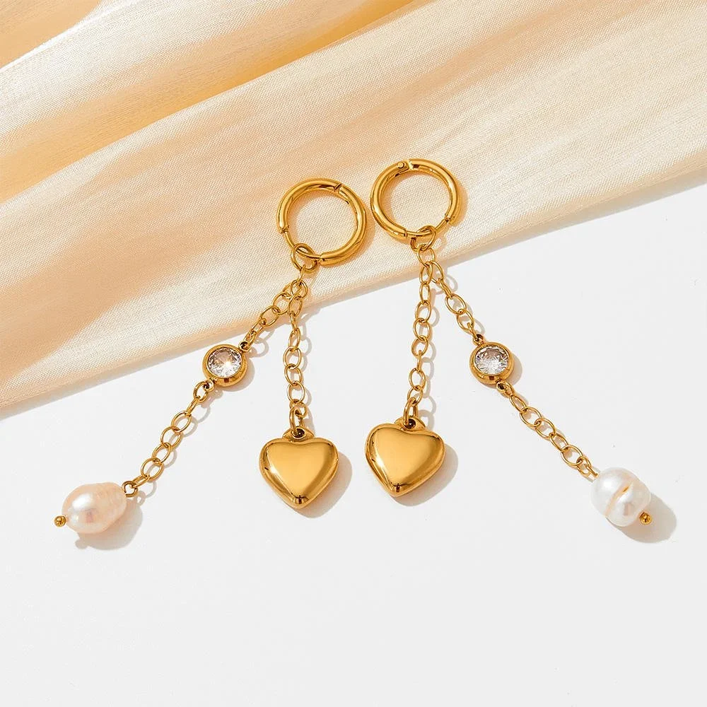 Close-up of Eternal Love Pearl Heart Gold Drop Earrings highlighting the pearl details, heart drop design, and elegant gold setting.