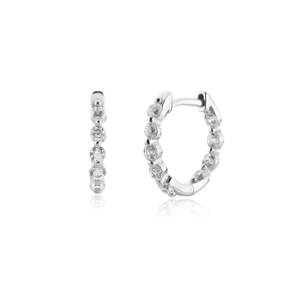 Gold Pavé Huggie Hoop Earrings featuring sparkling cubic zirconia stones set along a sleek gold hoop design for an elegant everyday look.
