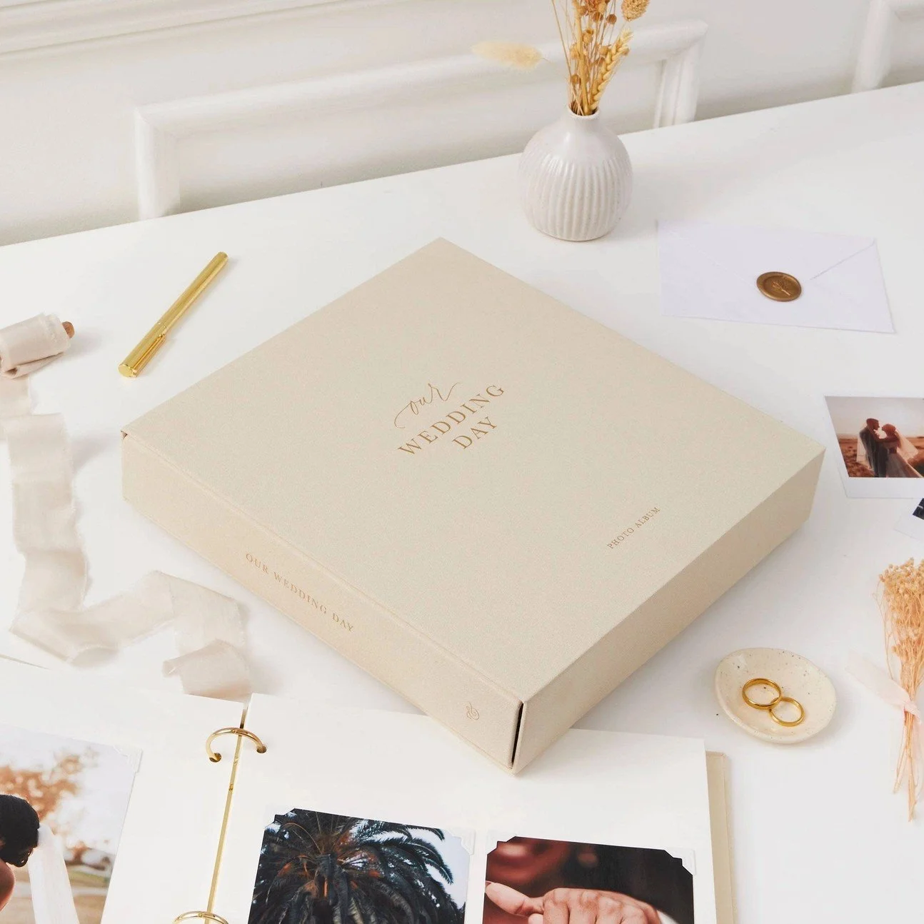 Heirloom wedding photo album with soft ivory fabric cover for preserving bridal and wedding photography.