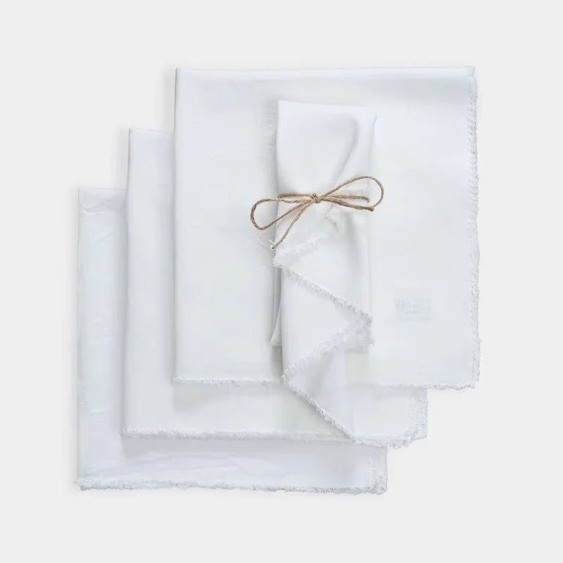 White 50% cotton 50% linen fringe cloth napkin set for weddings, holidays, and everyday entertaining.