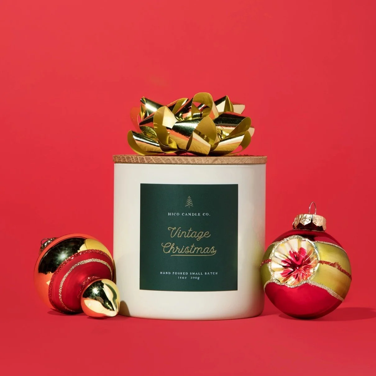 14 oz Christmas soy candle in an ivory glass jar with a festive pine, cedarwood, cinnamon, clove, orange peel and caramel fragrance, perfect for cozy winter evenings and Christmas gifting.