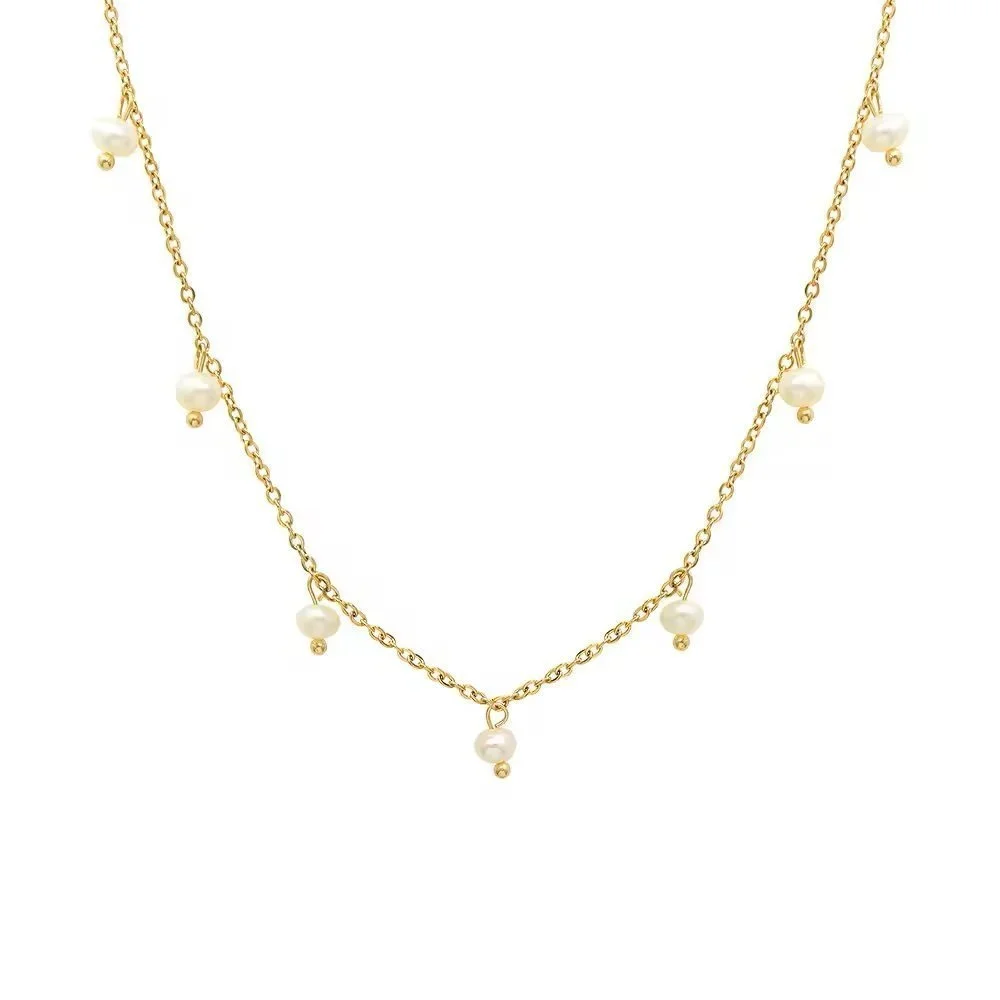 Floating Freshwater Pearl Gold Necklace featuring delicate freshwater pearls spaced along a polished gold chain for an elegant and timeless look.