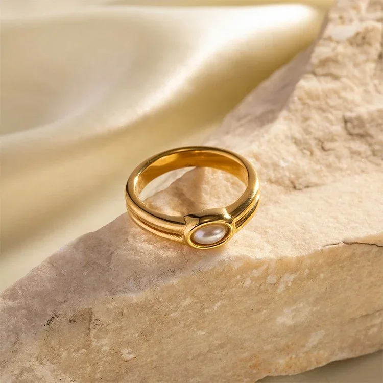 Close-up of Alexandra Gold Freshwater Pearl Ring highlighting the natural pearl detail, delicate gold setting, and stackable ring style.
