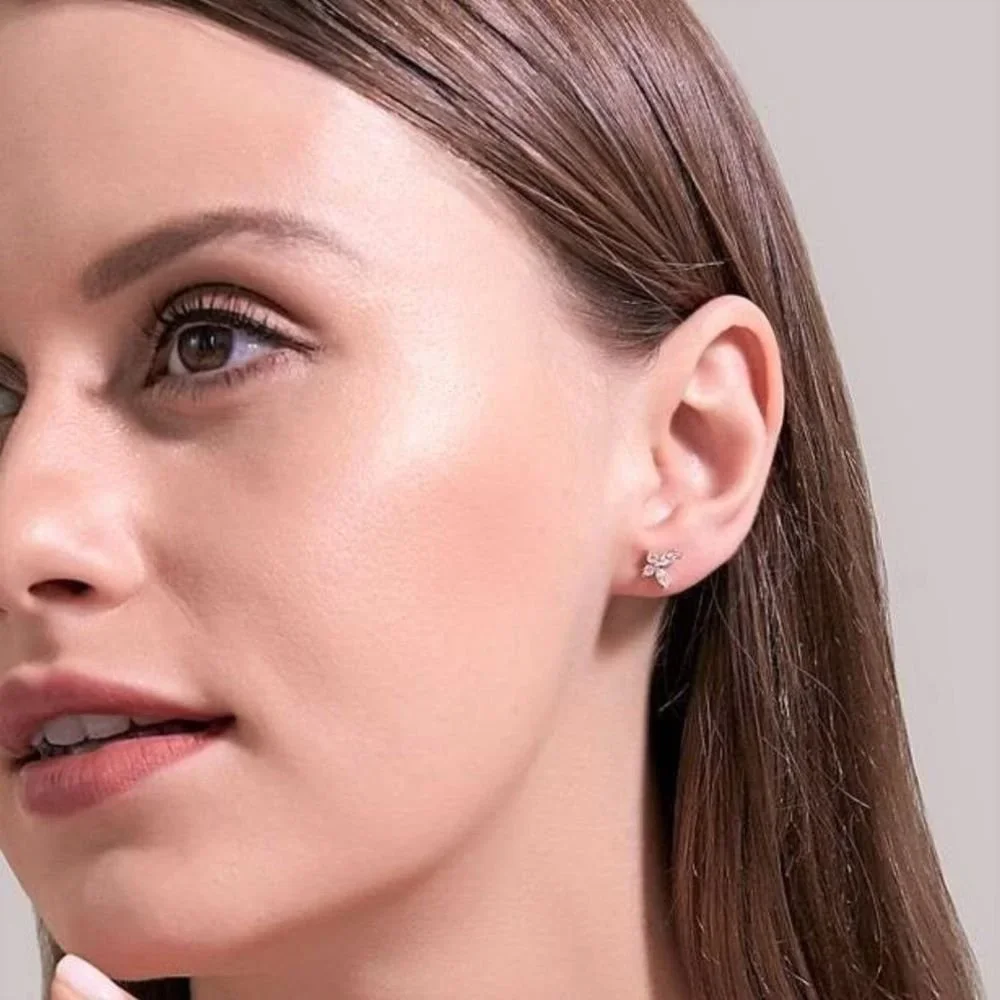 Gold Butterfly CZ Stud Earrings worn on model, showcasing a feminine and delicate everyday gold jewelry style.