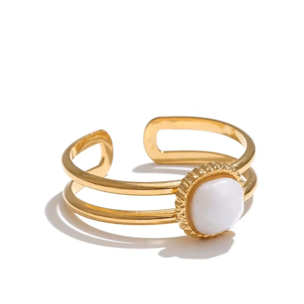 Aria Adjustable Gold Ring featuring a white gemstone centerpiece with a polished gold finish and elegant minimalist design for everyday wear.