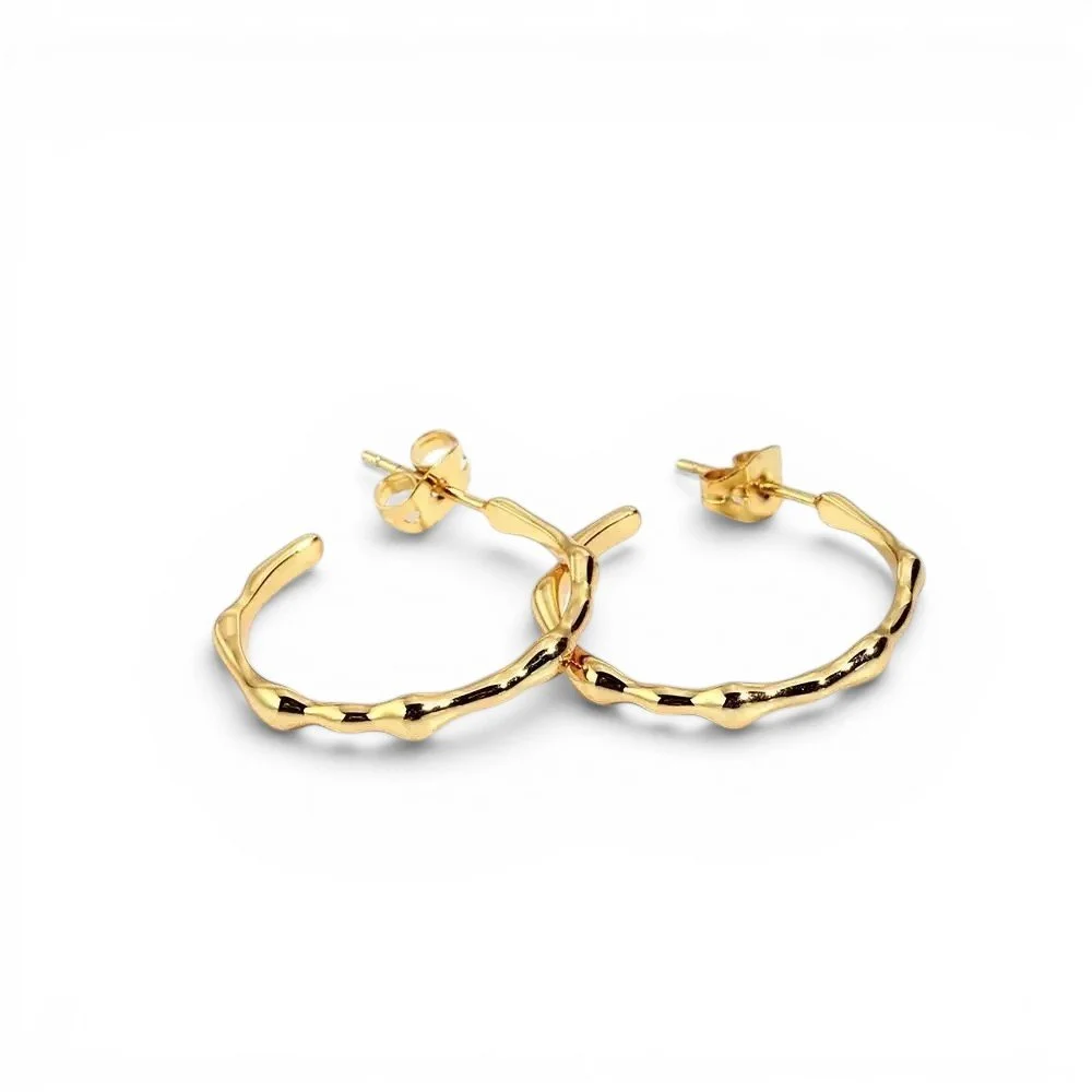 Textured gold hoop earrings medium is size for everyday wear.