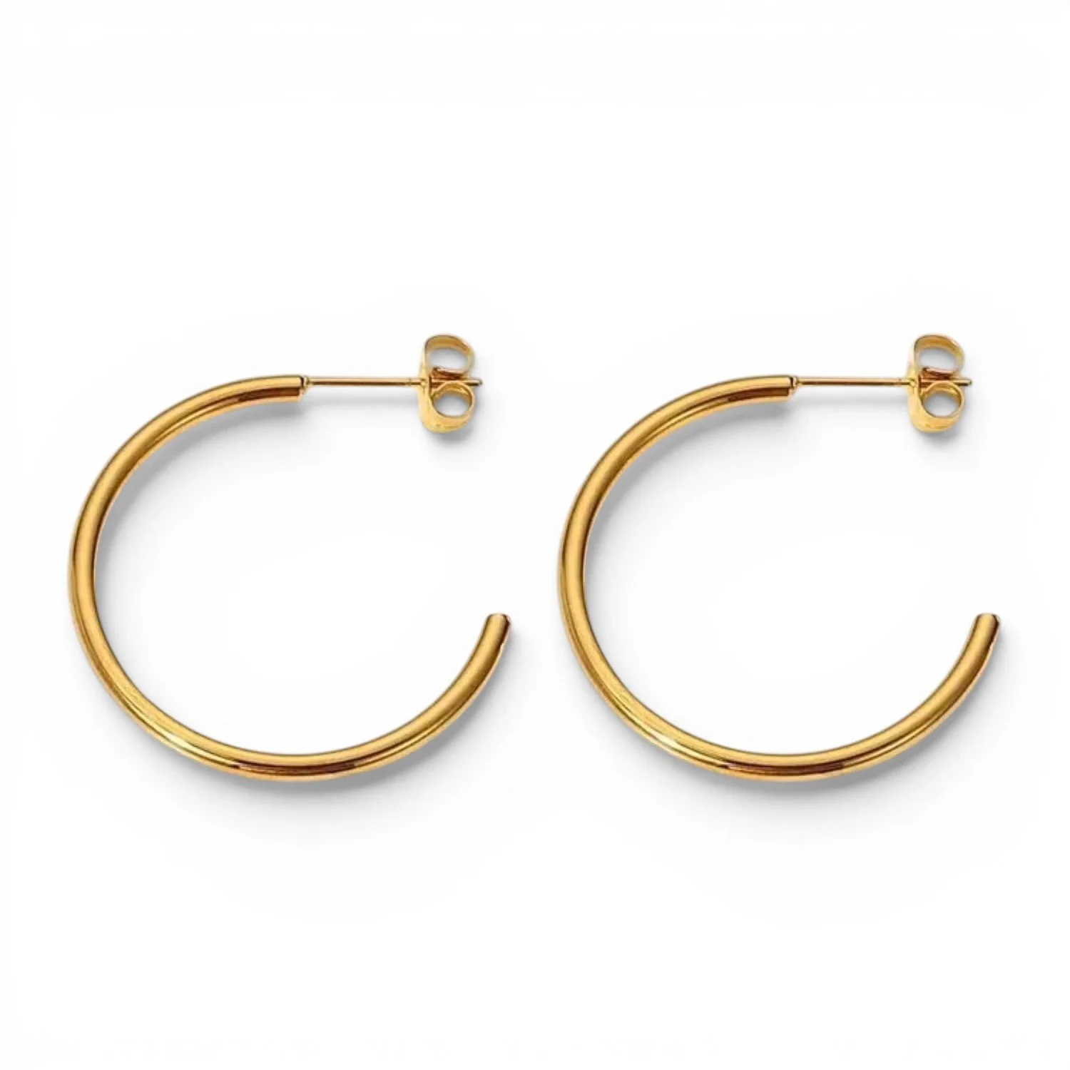 Women's gold hoop earrings that are tarnish-free, hypoallergenic, and waterproof.