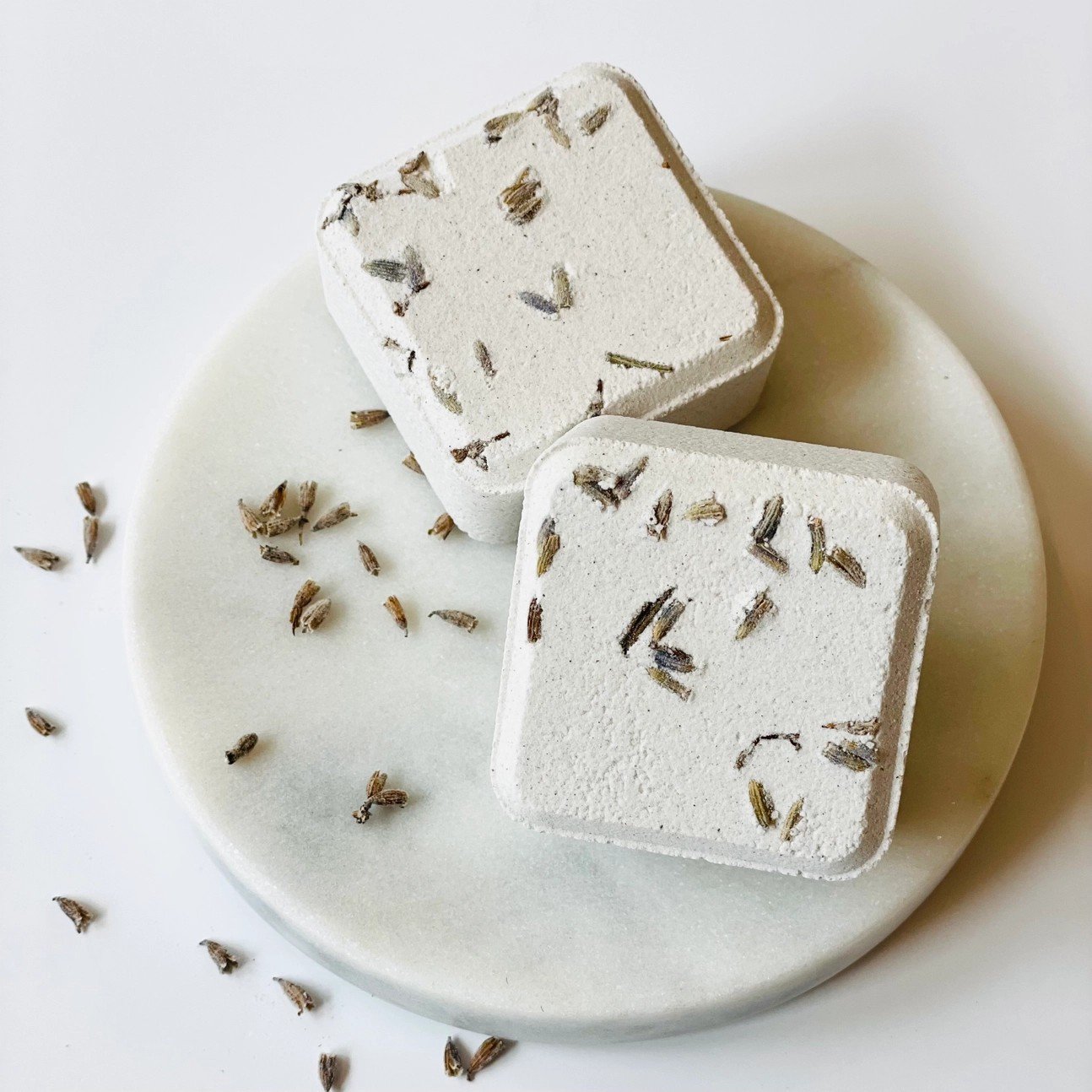 Tranquil and relaxing ylang ylang cedarwood scented shower steamers for self-care.