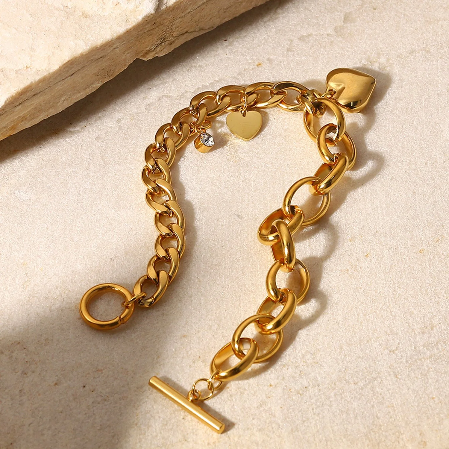 Gold Amour heart charm bracelet styled for everyday wear.