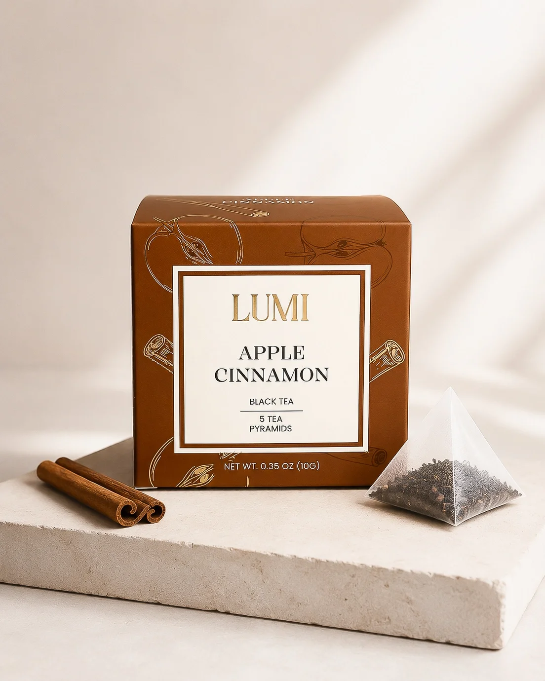 Apple cinnamon herbal tea with apples and cinnamon sticks.