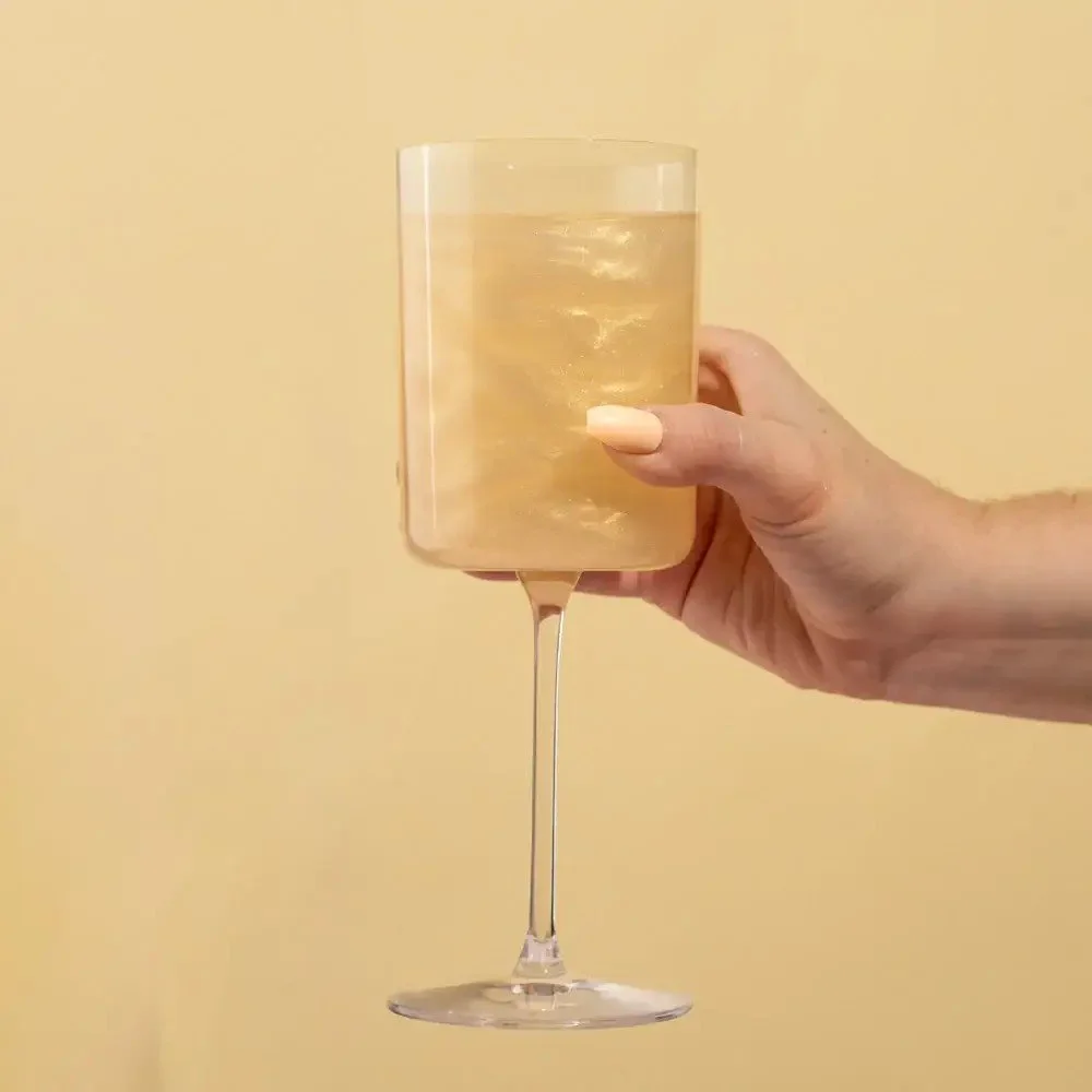 Party drink enhancer with cotton candy flavor and glitter infusion for bridal showers and celebrations.