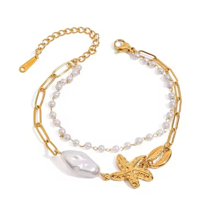 Gold Pearl Starfish Double Strand Bracelet featuring layered gold chains, a delicate starfish charm, and pearl accents with a polished finish.