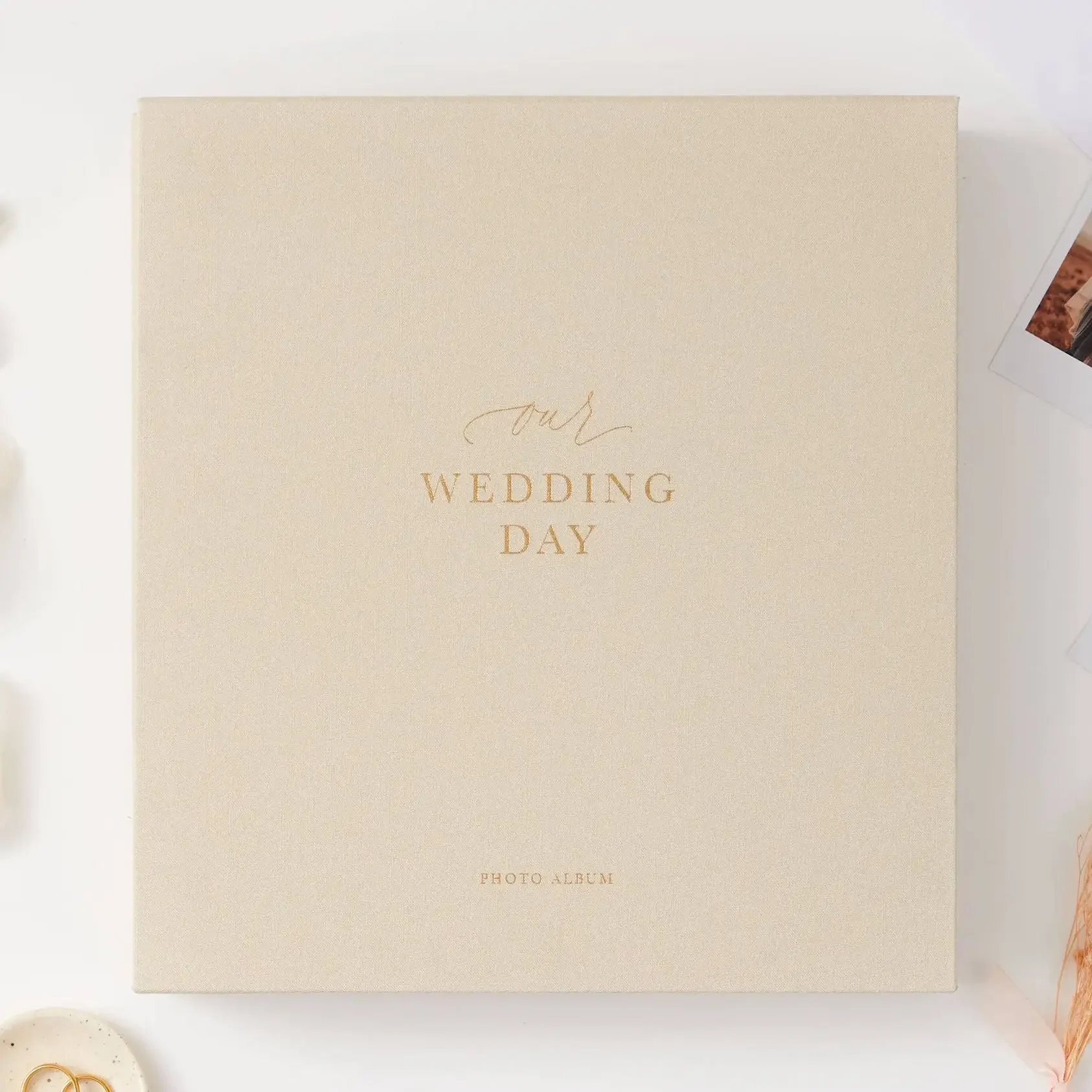 Luxury ivory cloth wedding photo album with elegant linen cover and archival pages for preserving wedding memories.