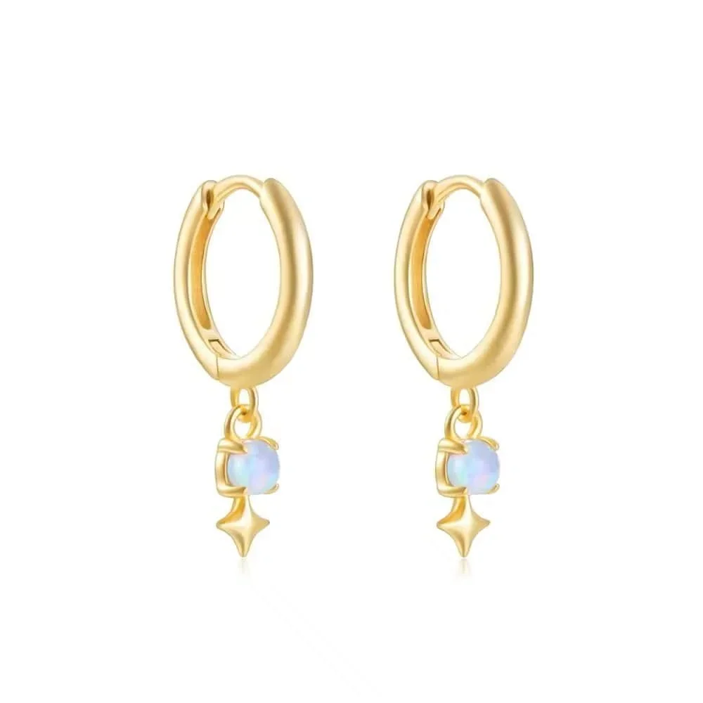 Stardust Gold Opal Huggie Earrings featuring luminous opal accents with a polished gold huggie hoop design and celestial-inspired style.
