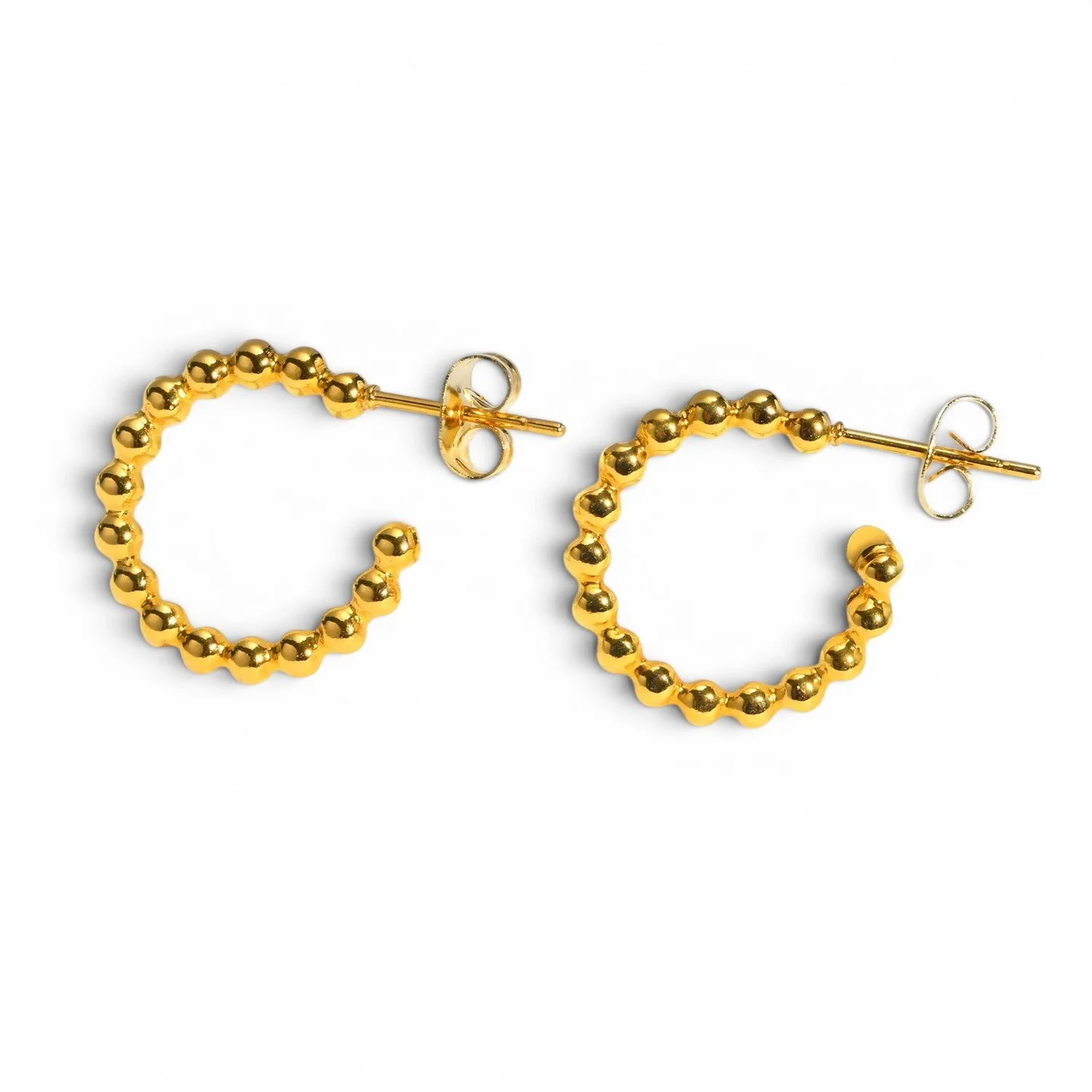 Medium sized gold polished hoop earrings for everyday wear.