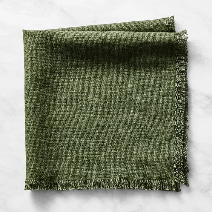Premium forest green cotton linen blend fringe edged dinner napkin set.
