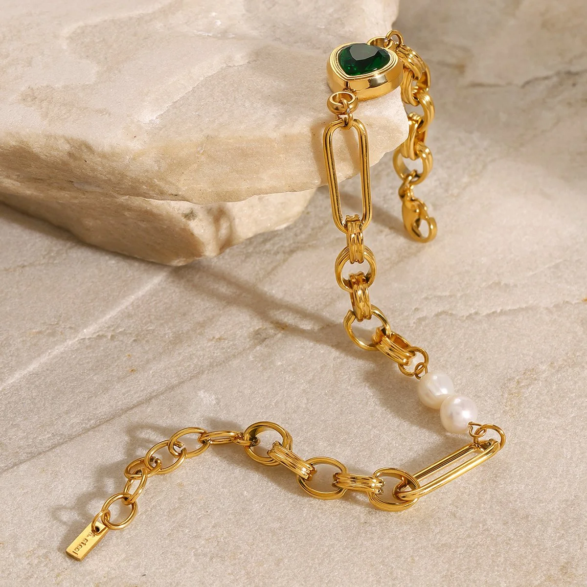 Gold emerald pearl chain link bracelet.