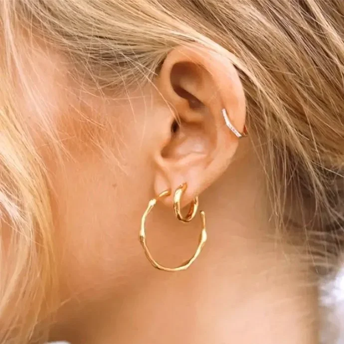 Saint-Tropez Medium Gold Hoop Earrings worn on model, showcasing a chic and versatile gold jewelry look for everyday outfits.