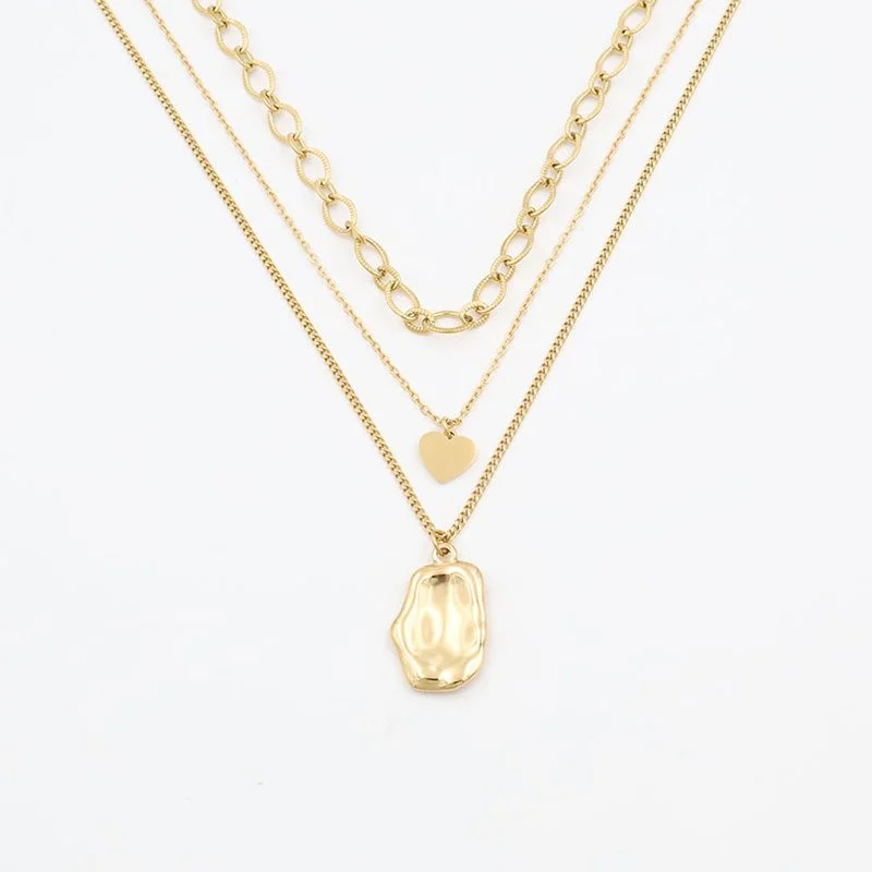 Gold triple layered charm necklace for women.