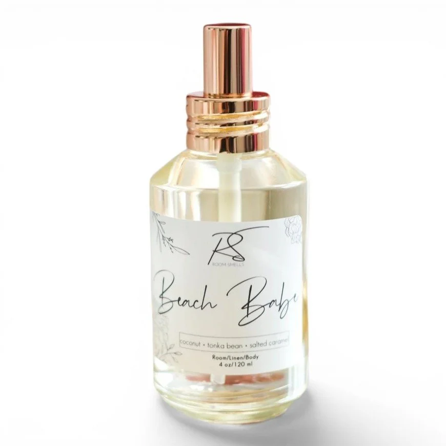 A perfume in a clear glass bottle with coconut, tonka bean, and salted caramel fragrance notes.