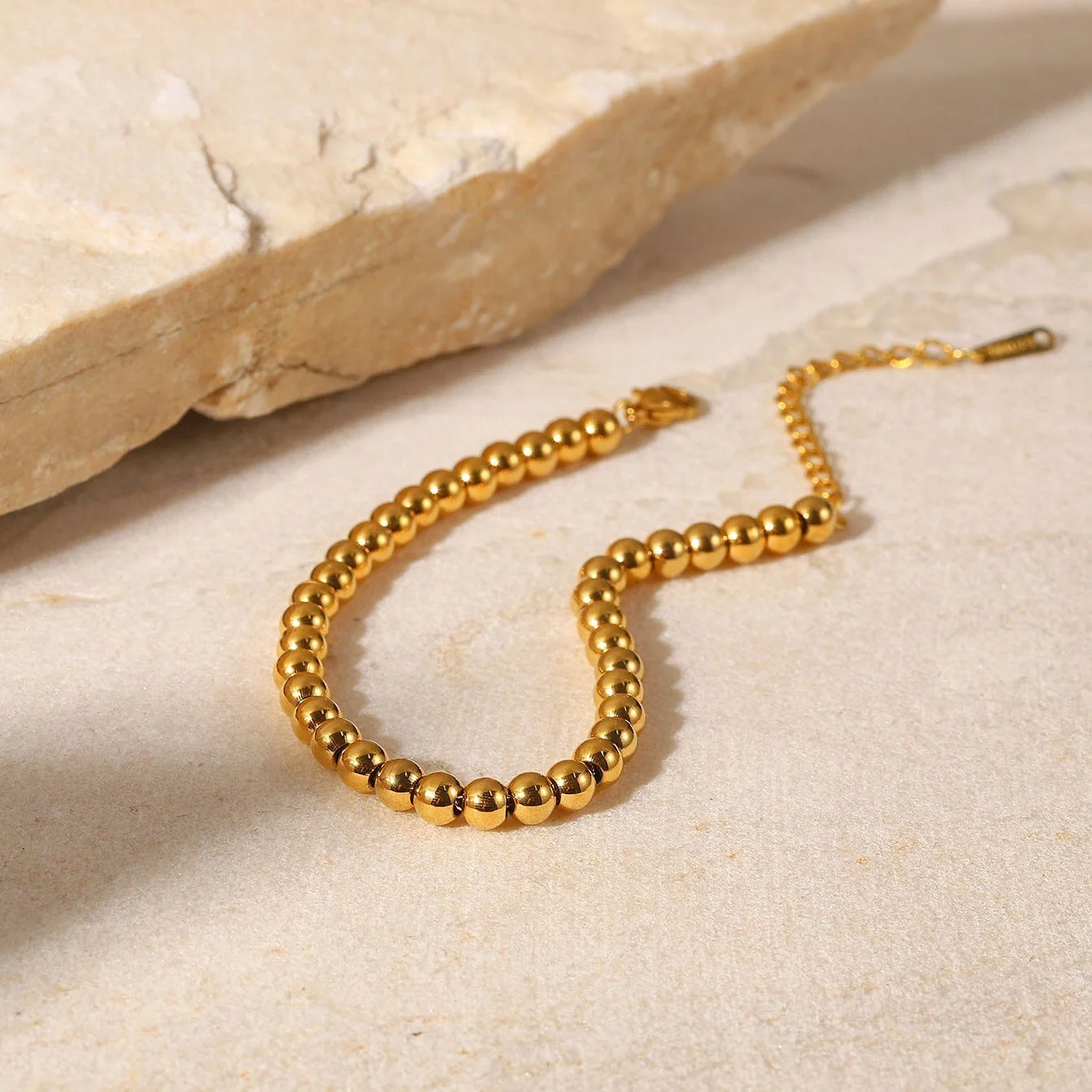 Gold bead bracelet that is hypoallergenic, tarnish-free, and waterproof.