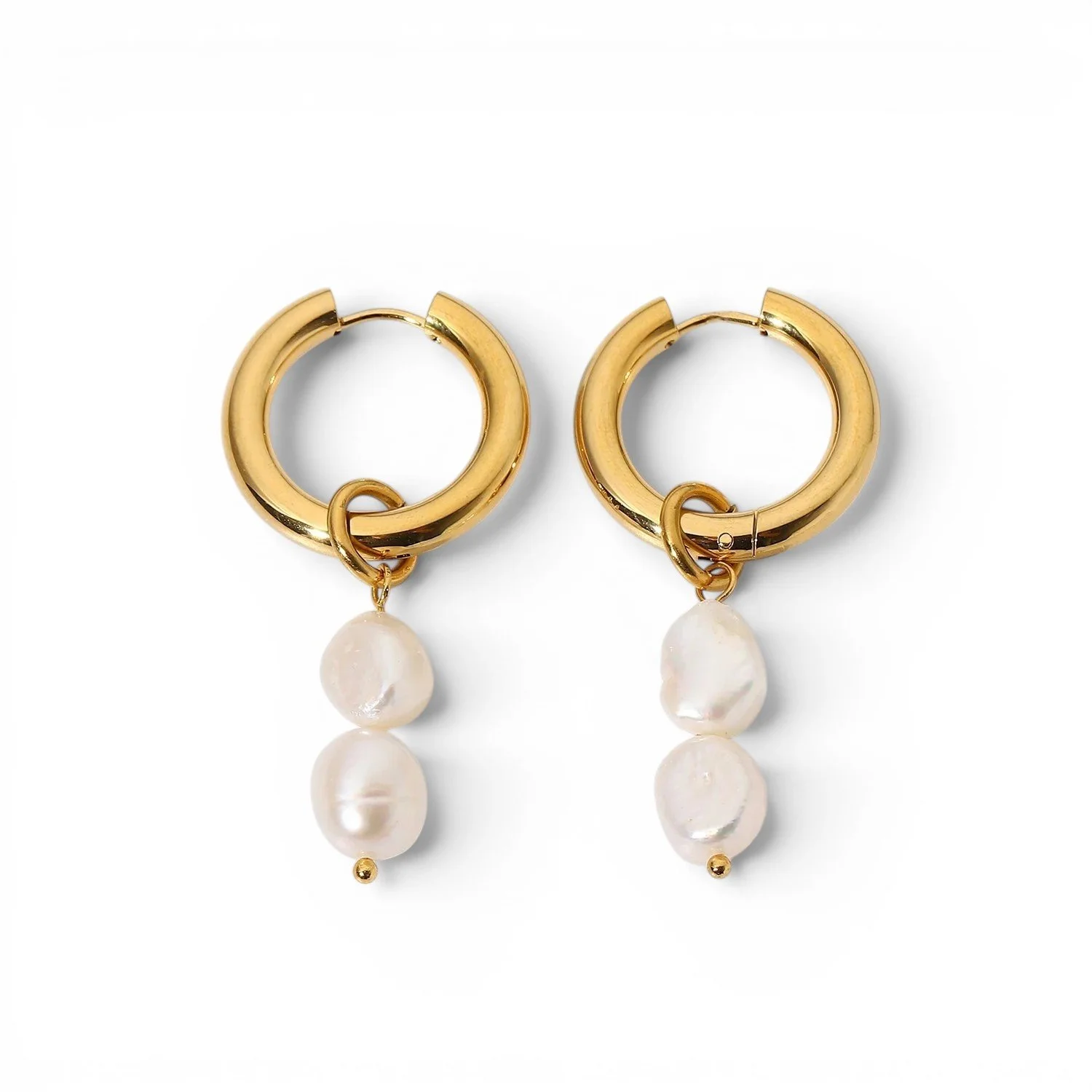 Handcrafted pearl dangle earrings with white freshwater pearls and gold hoops.