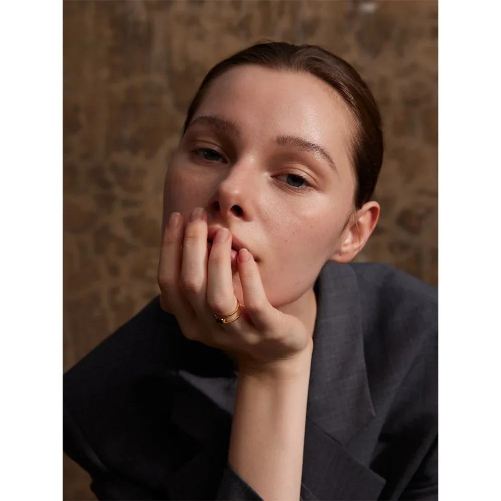 Parker Emerald Gemstone Gold Ring worn on finger, showcasing a sophisticated gemstone jewelry style perfect for everyday wear or special occasions.