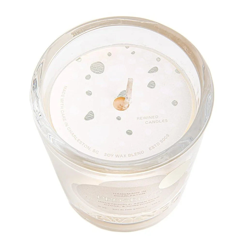 6 oz champagne soy candle in a glass jar, perfect for celebrations and gifting.