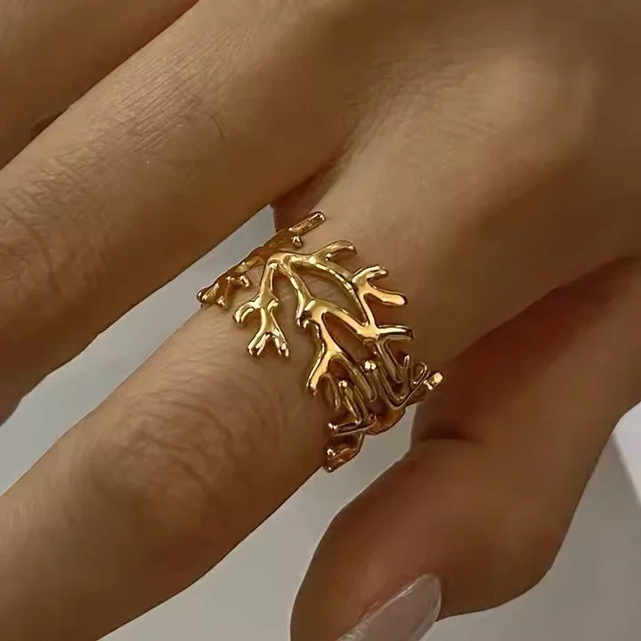 Coral Reef Adjustable Gold Ring worn on finger, showcasing a delicate beach-inspired jewelry style perfect for everyday wear.