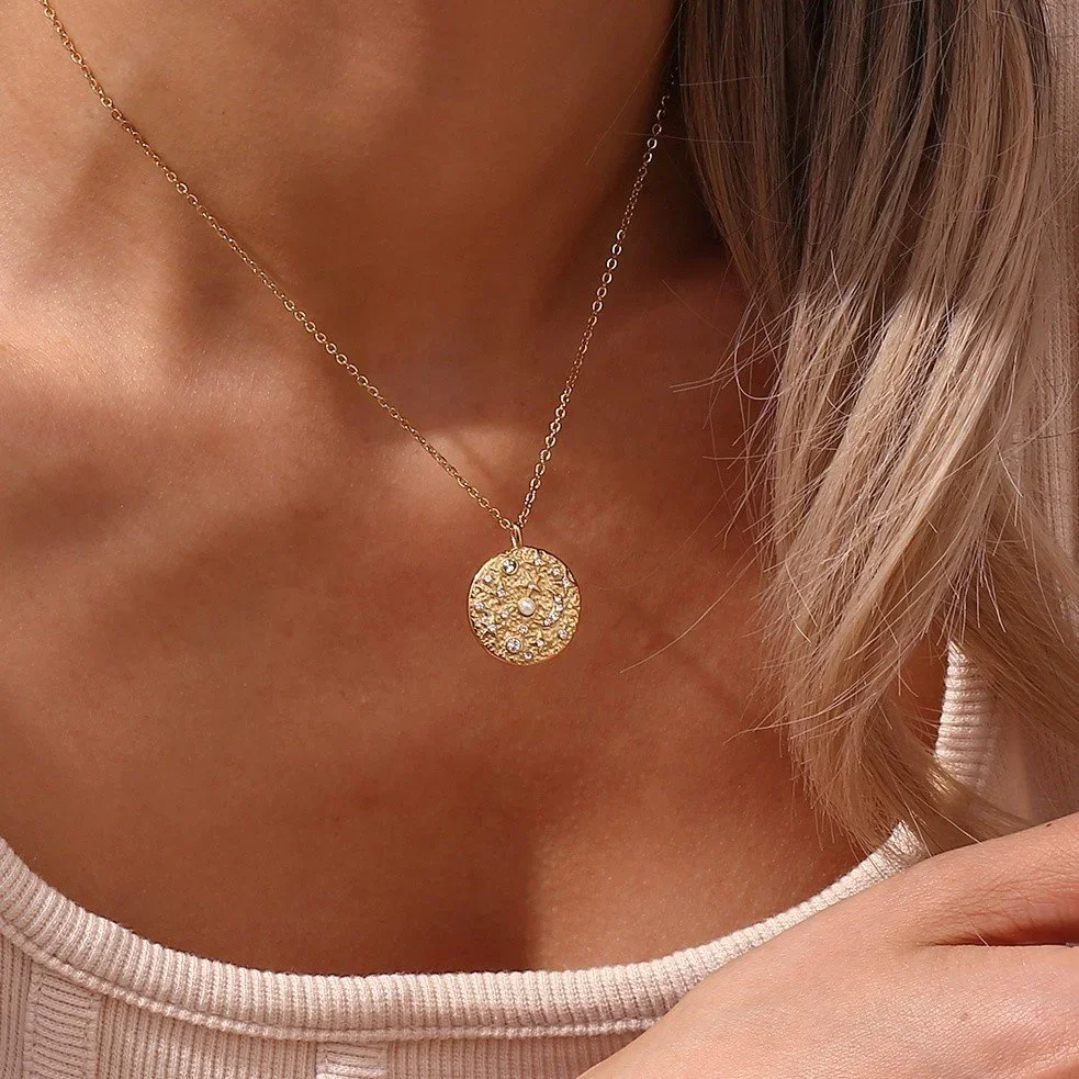Gold Moon & Star Constellation Pendant Necklace worn on model, showcasing a celestial-inspired gold jewelry style perfect for everyday wear or layering.
