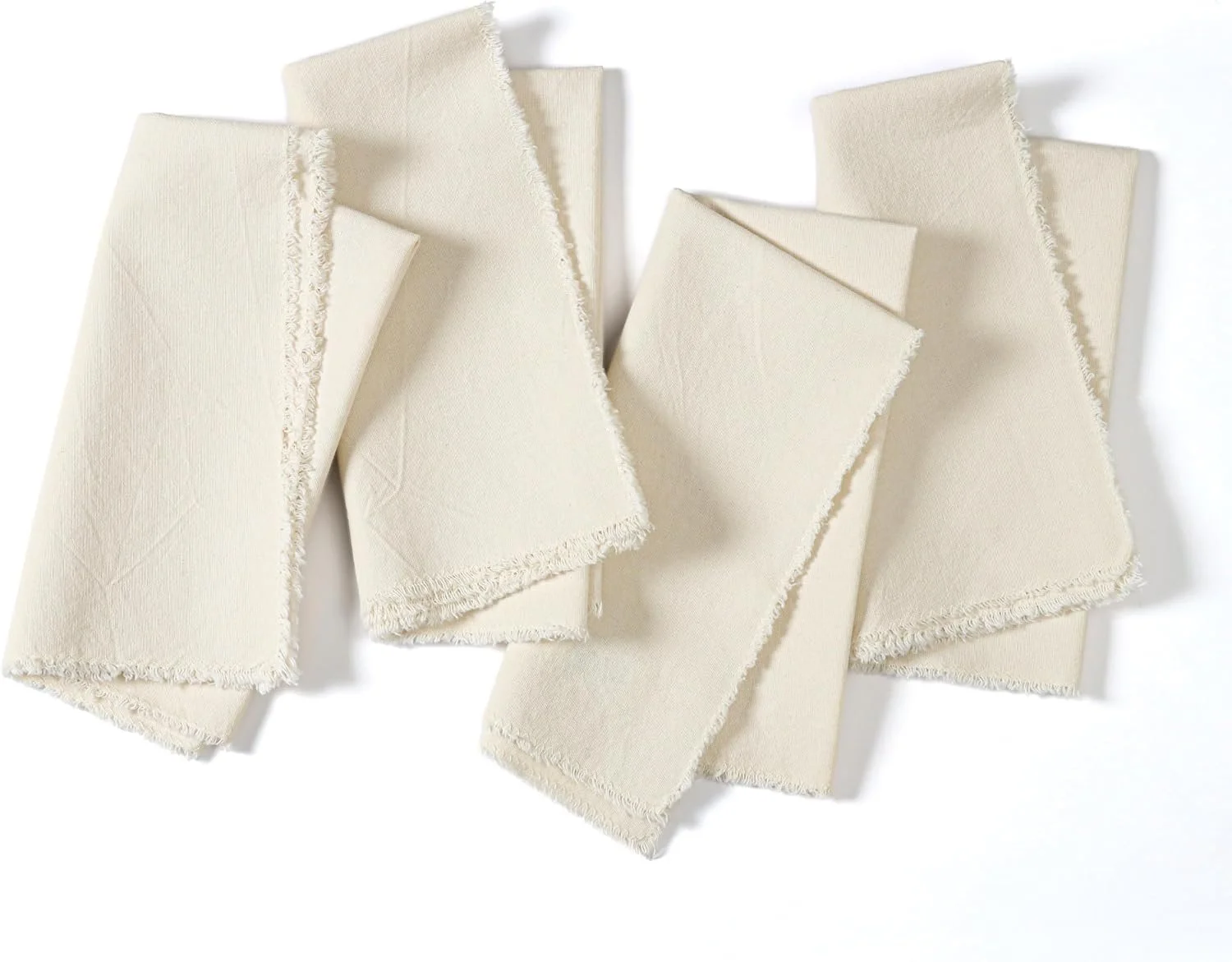 Set of four light beige 50% cotton 50% linen napkins with textured woven fabric and fringe trim, perfect for entertaining, holidays, and modern table décor.