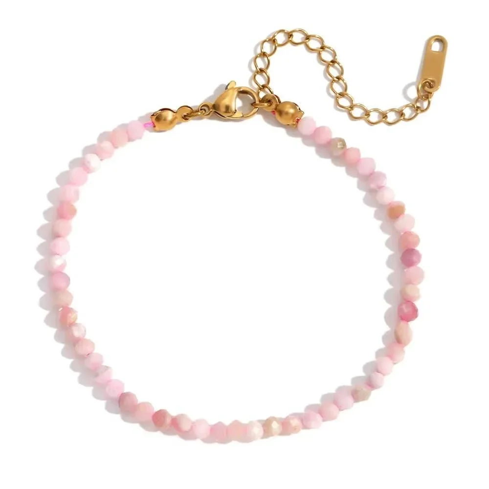 Pink Rose Quartz Beaded Gold Bracelet featuring soft pink gemstone beads with elegant gold accents, creating a feminine and delicate everyday jewelry style.