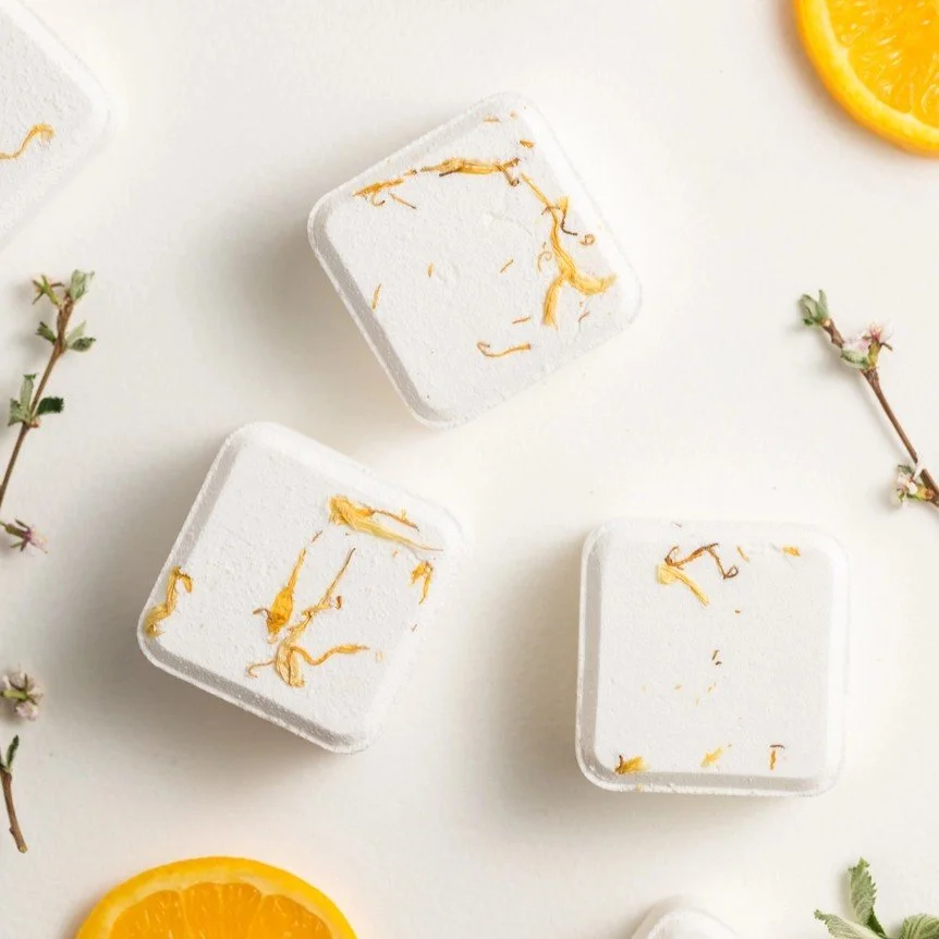 Jasmine and orange scented aromatherapy tablets for shower routines.