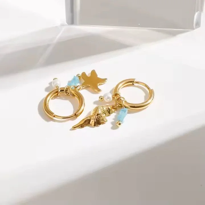 Gold marine charm hoop earrings for women, a unique ocean-inspired jewelry gift perfect for vacations, birthdays, and special occasions.