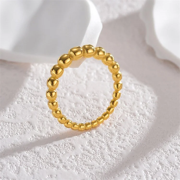 Gold stacking ring that is tarnish-free, hypoallergenic, and waterproof.