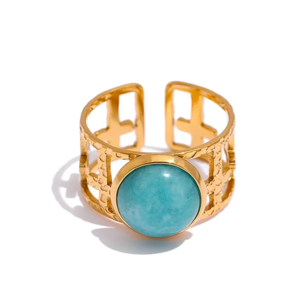 Portofino Adjustable Gold Ring featuring an aqua blue gemstone centerpiece with a polished gold finish and elegant open band design.