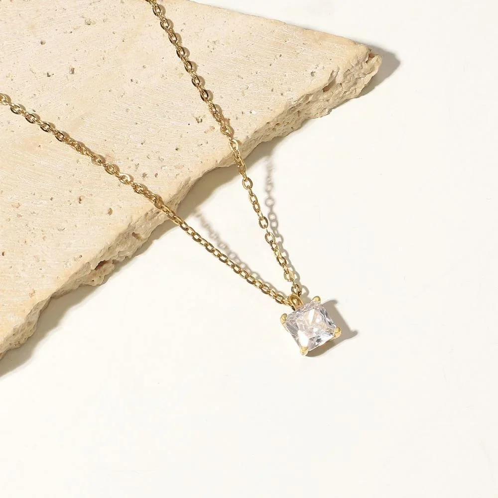 Close-up of CZ Gold Pendant Necklace highlighting the brilliant cubic zirconia stone, gold setting, and delicate chain details.