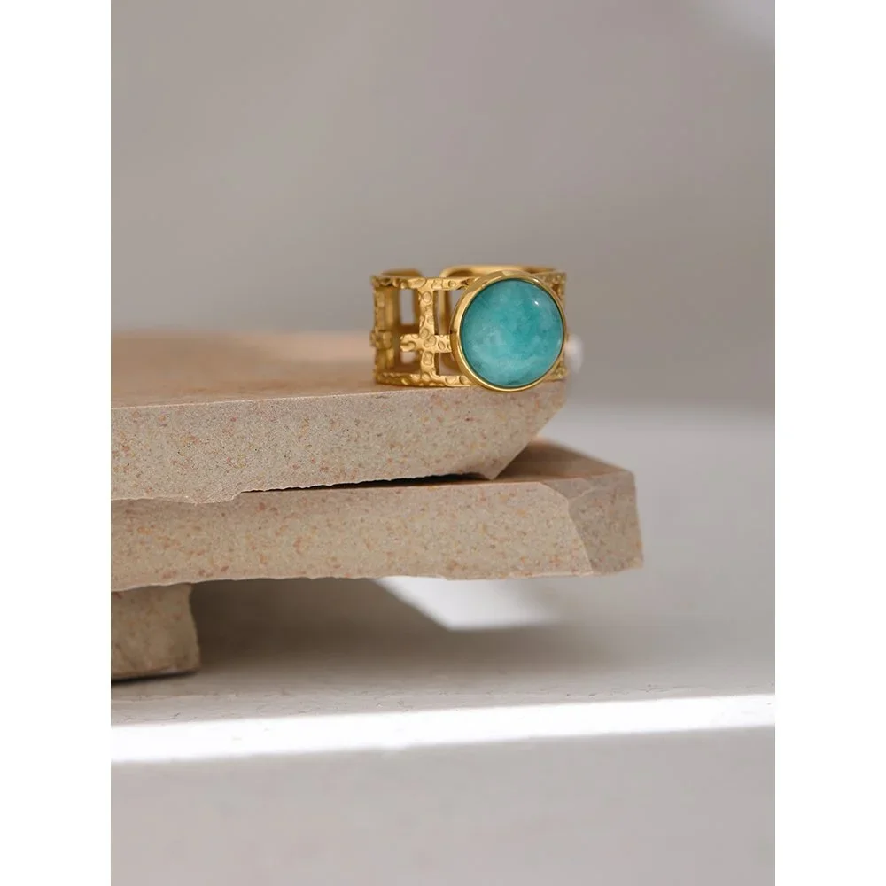 Close-up of Portofino aqua blue gemstone gold ring highlighting the vibrant blue stone, adjustable band, and refined gold details.