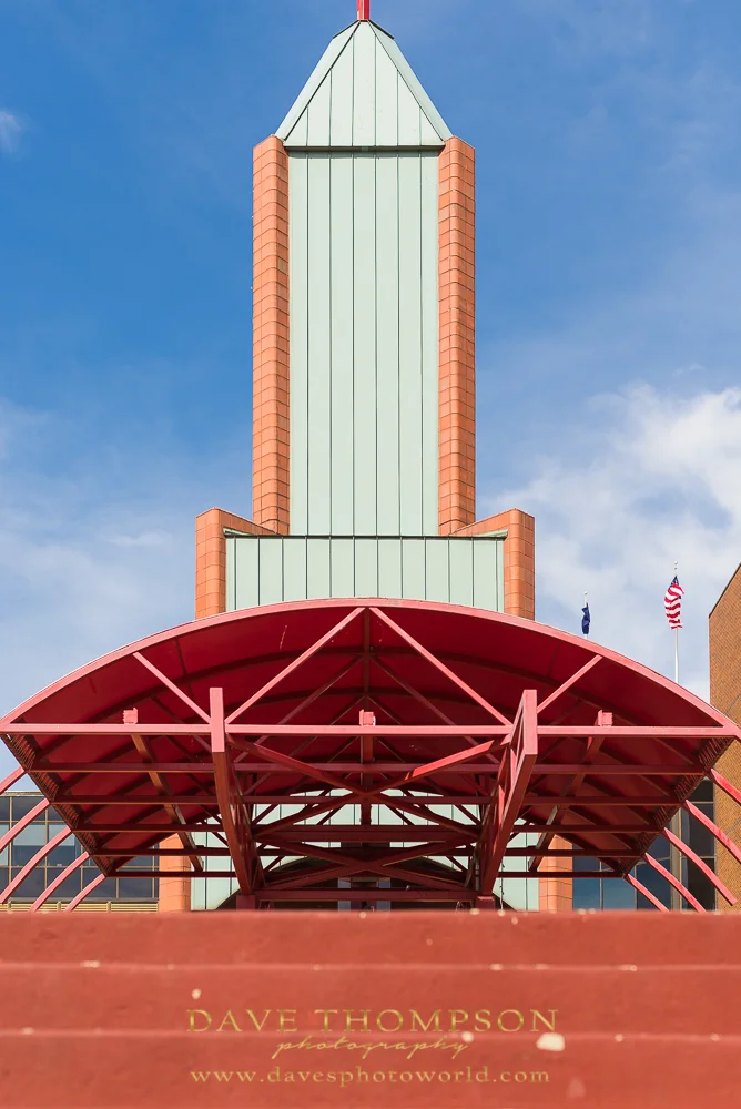 The straight lines and contrasting colors of this archictecture in downtown Elkhart caught my eye! The bright blue sky behind made a great background. There's room under this awning for couples photography for sure!