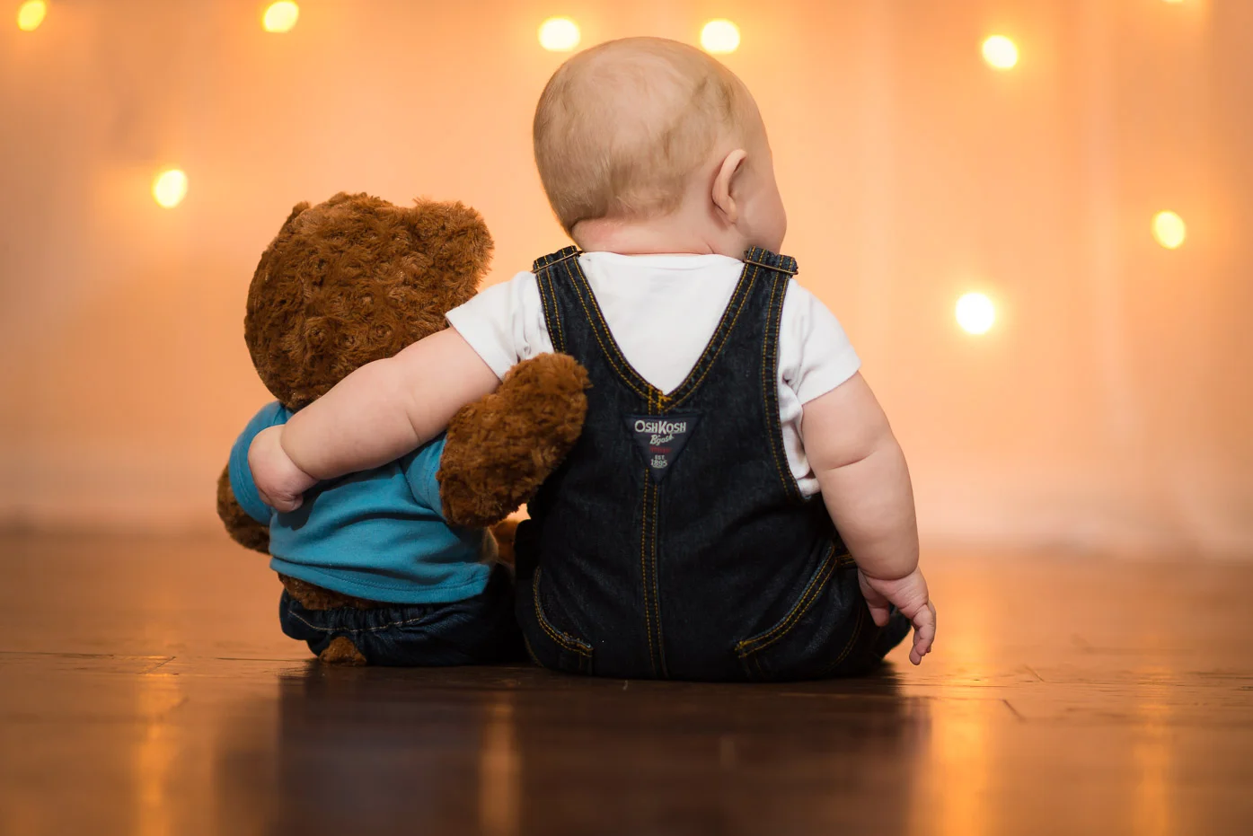 Toddler Hugging a Teddy Bear