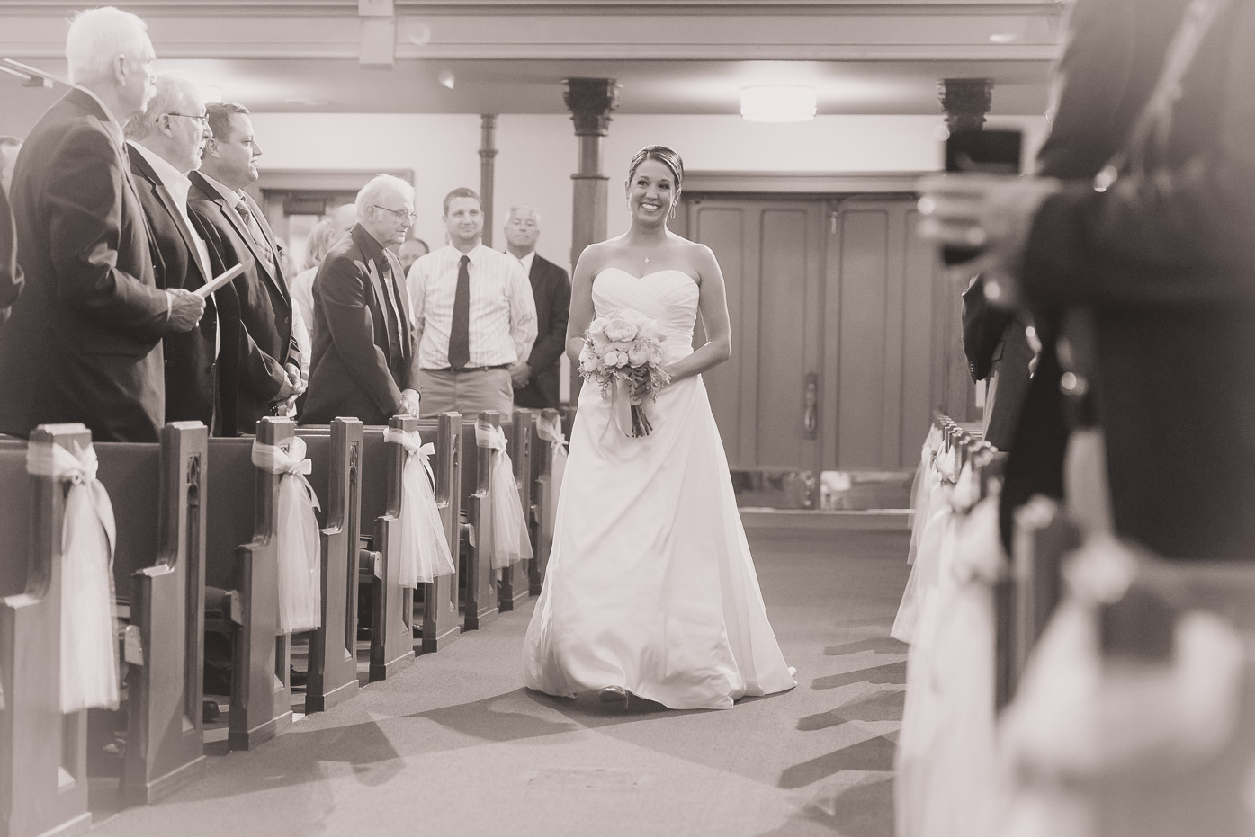 Smiling Bride Walking Down the Isle