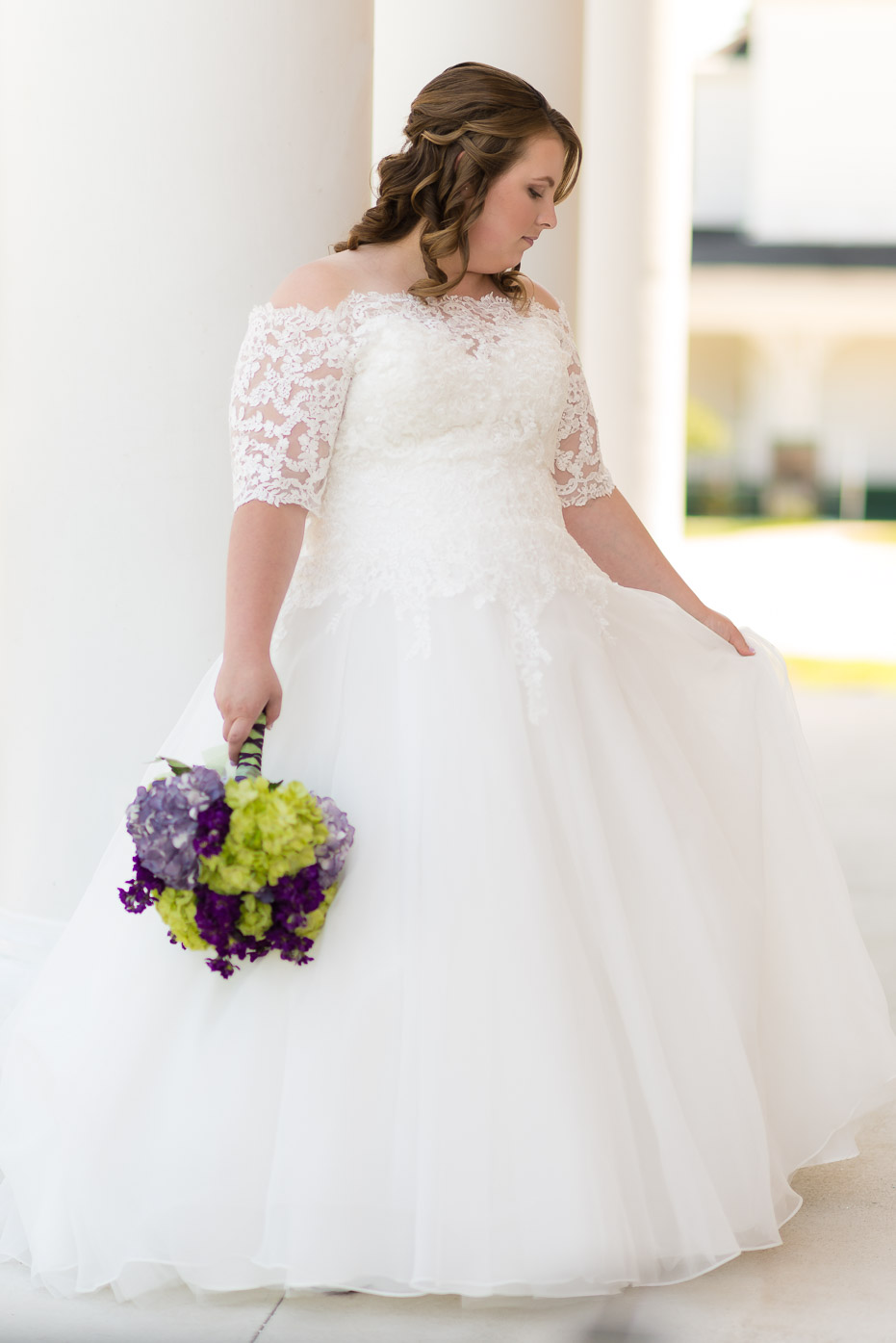 Wedding Gown with Green and Purple Bouquet