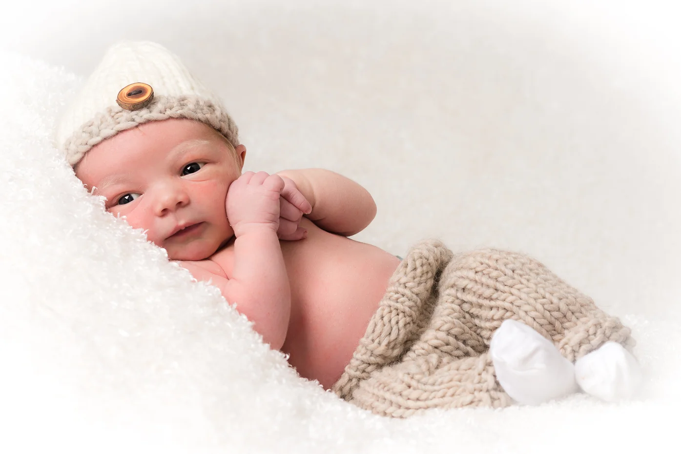 Cute newborn portrait cuddled up