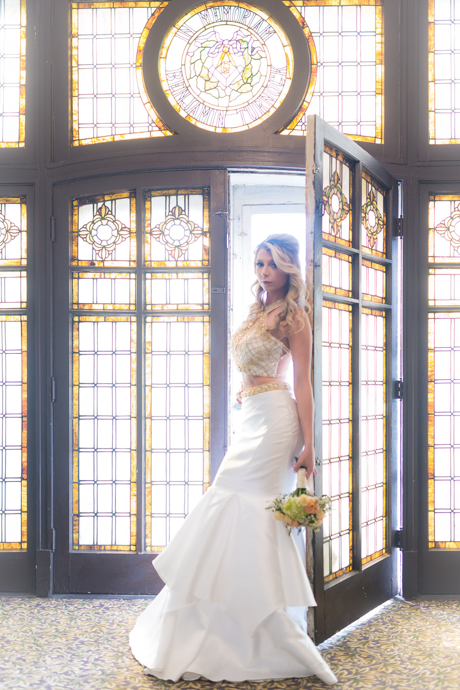 Stunning bride with bouquet with stained glass