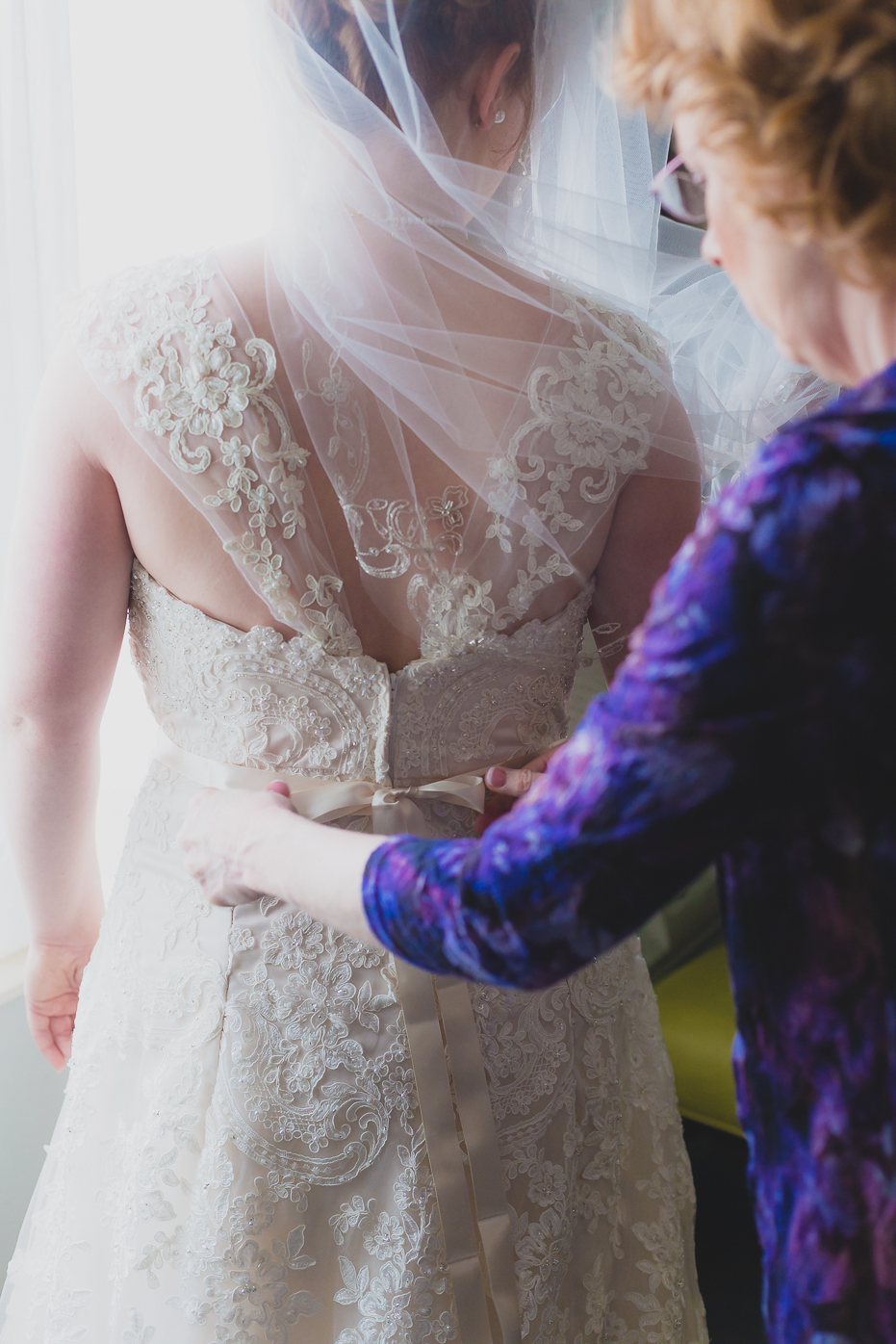 Mom Helping Daughter with Dress