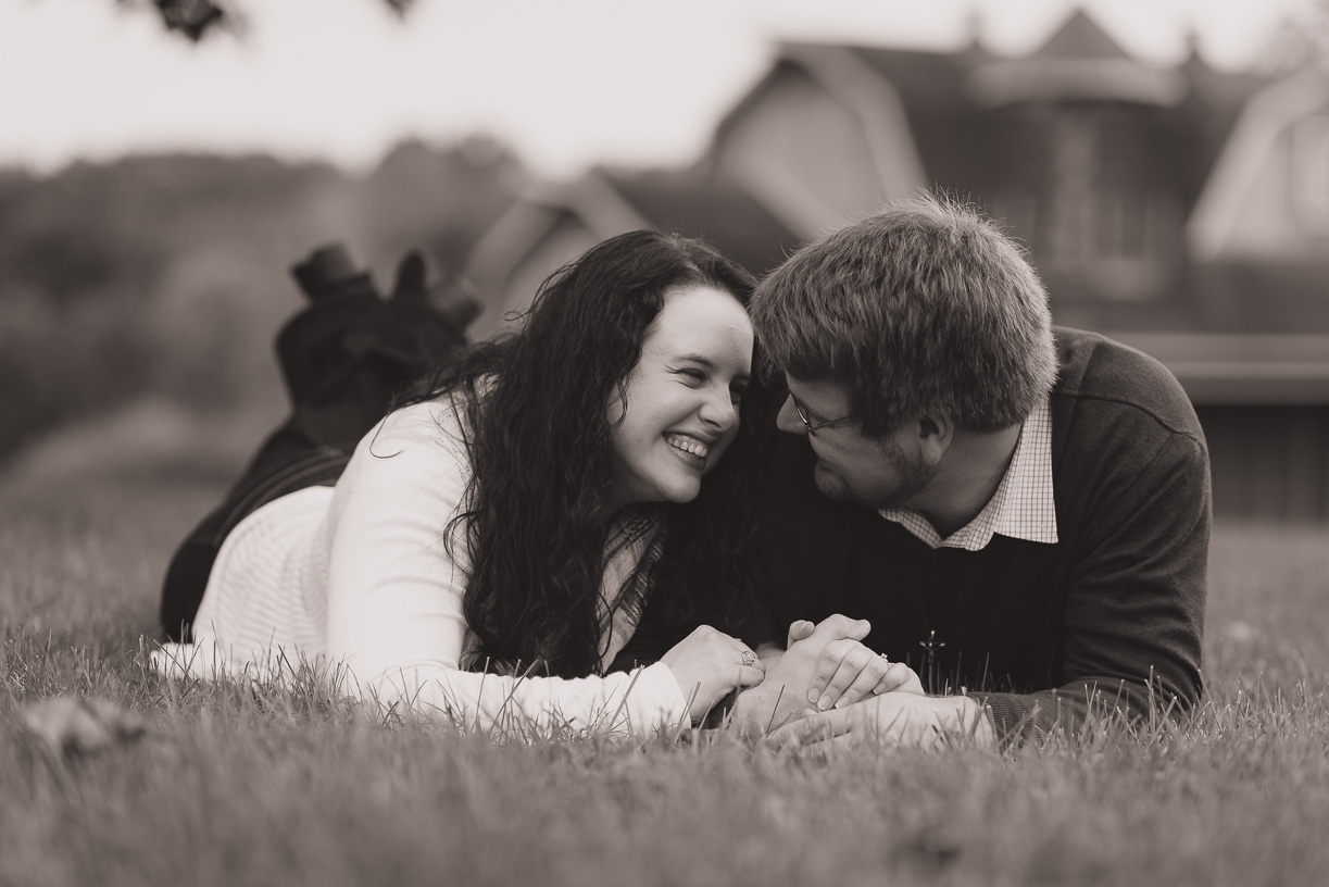 Couple in front of blue barn in the park