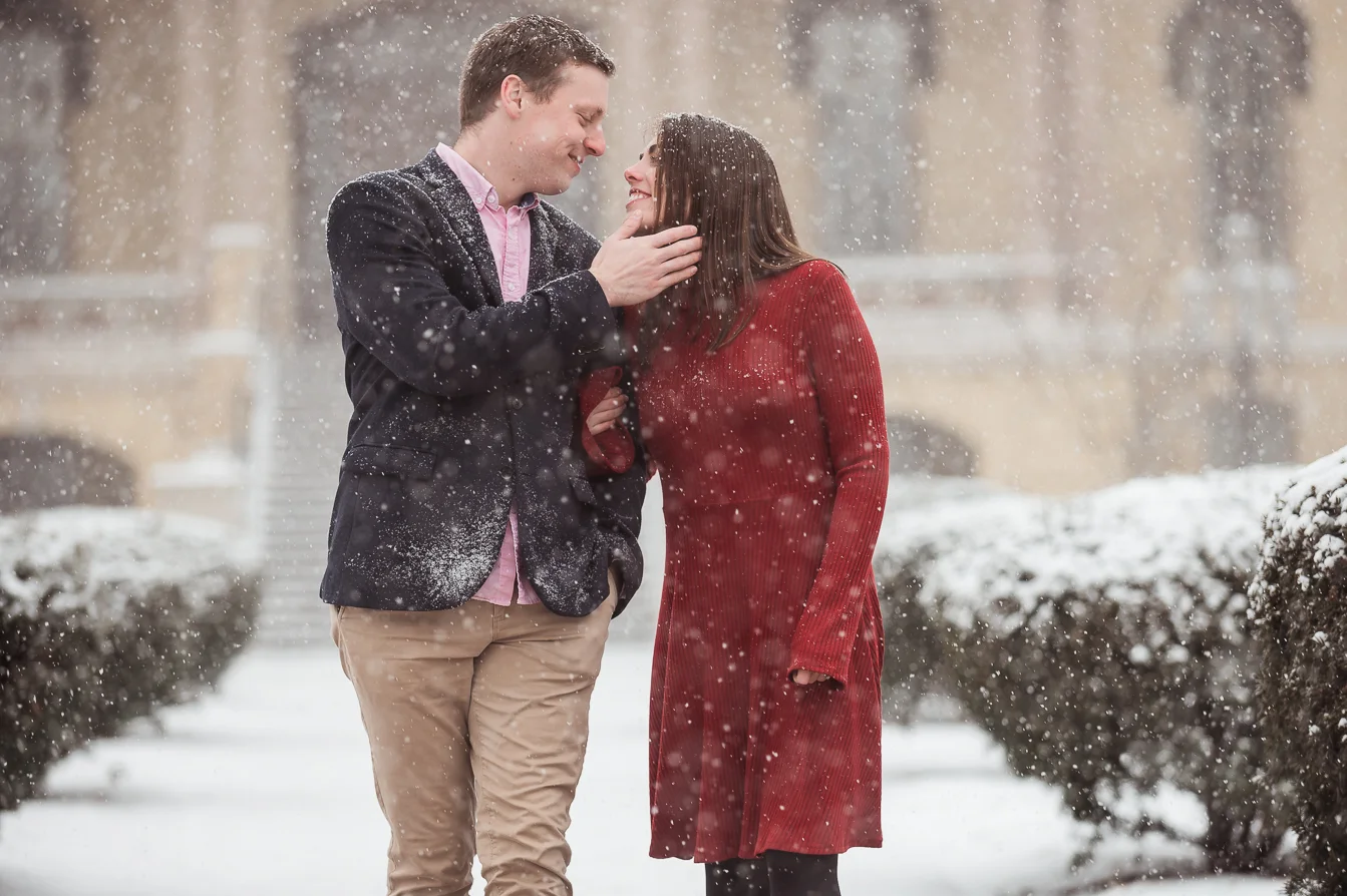 Suit and red dress in the snow